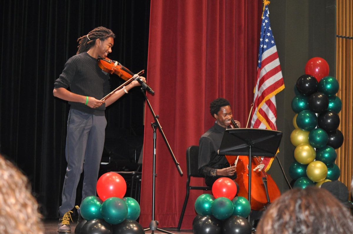 The Orchestra Club performs during the assembly.
