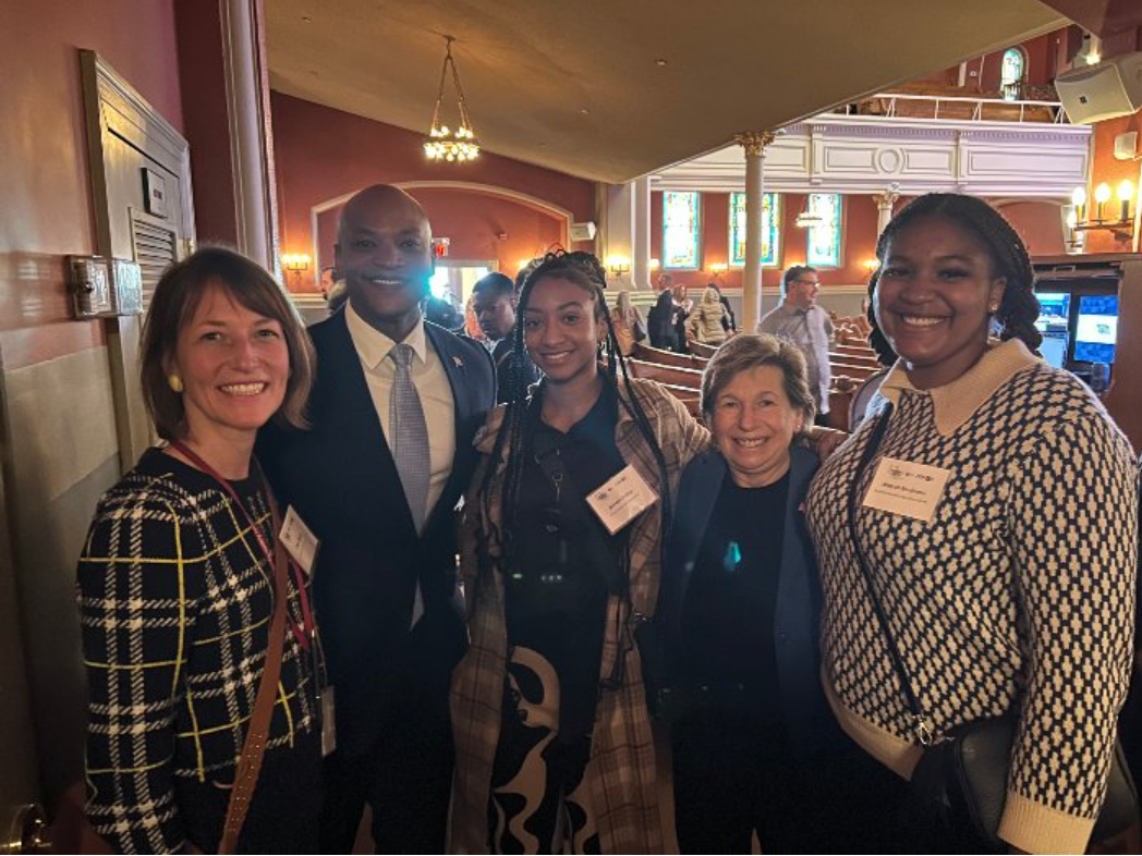 At the Passion Meets Purpose Conference, teacher Clare Berke (far left) and her students Bailey (center) and Benjamin (far right) met Governor Wes Moore (left of center) and President of the American Federation of Teachers Randi Weingarten (right of center).