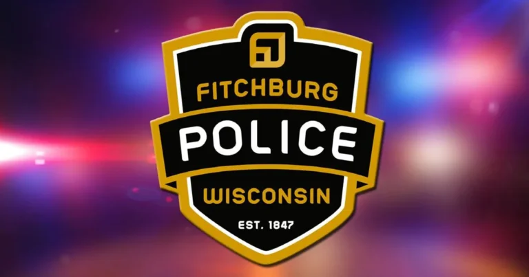 Fitchburg police vehicle parked near a dealership lot on East Badger Road