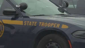 New York State Police cruiser parked outside a barracks after an arrest in Corinth
