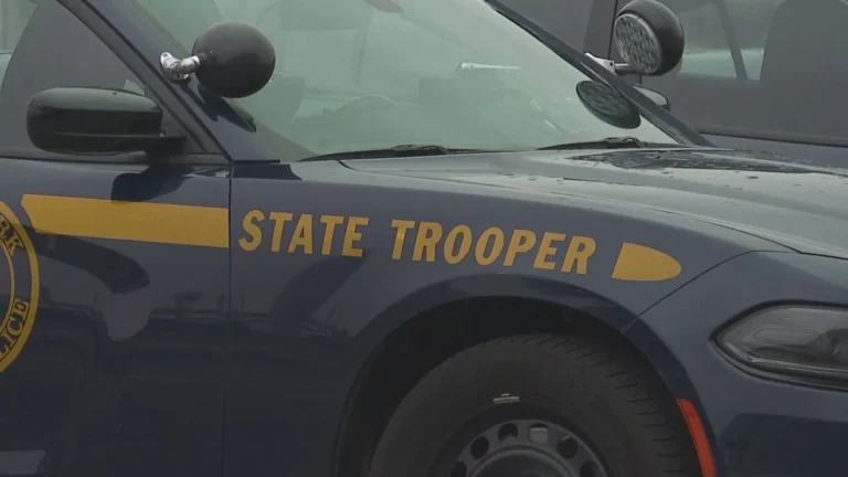 New York State Police cruiser parked outside a barracks after an arrest in Corinth