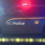 Police investigate a fatal shooting scene near a West Phoenix home