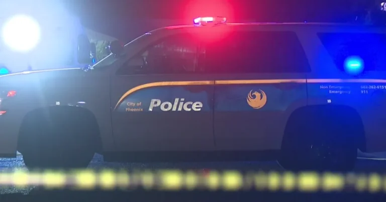 Police investigate a fatal shooting scene near a West Phoenix home