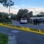 Police investigate a deadly shooting scene on a residential street in Bradenton