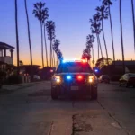 San Diego police vehicle parked near a college area street at night