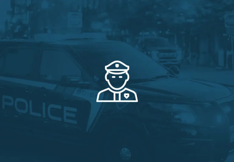 Boise police vehicle parked near a retail store during an organized retail crime investigation